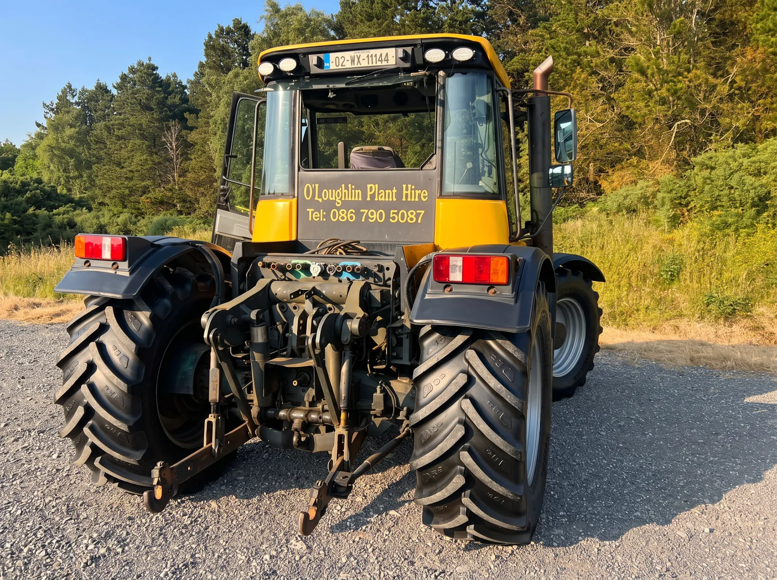 O'Loughlin Plant Hire JCB Fastrac tractor with branded cab and phone number
