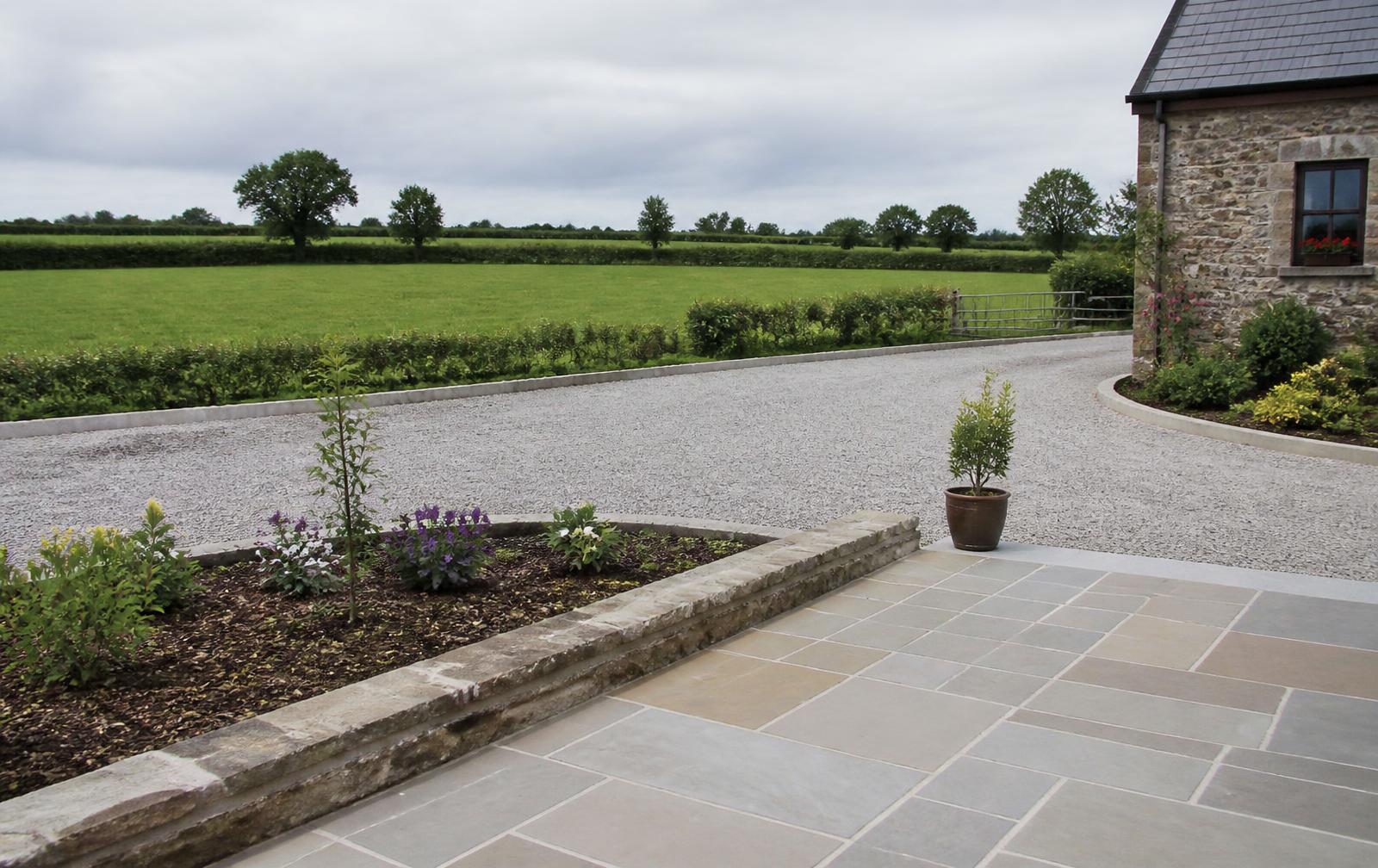 Newly laid stone patio and gravel driveway at a rural Irish stone house